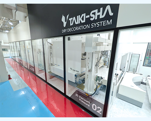 Photo of a test machine of the dry decoration system installed at the Technical Center.